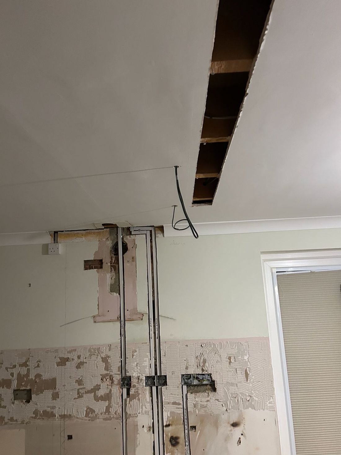 First fix in a kitchen ceiling, cable runs in