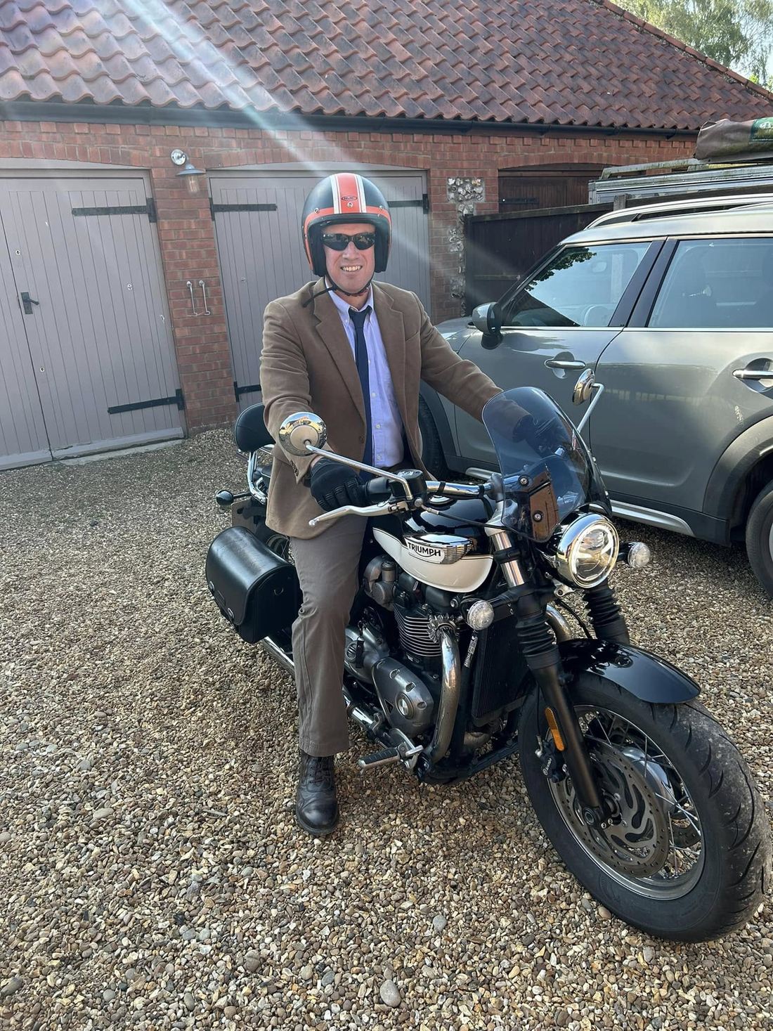 Matthew on his Triumph motorbike